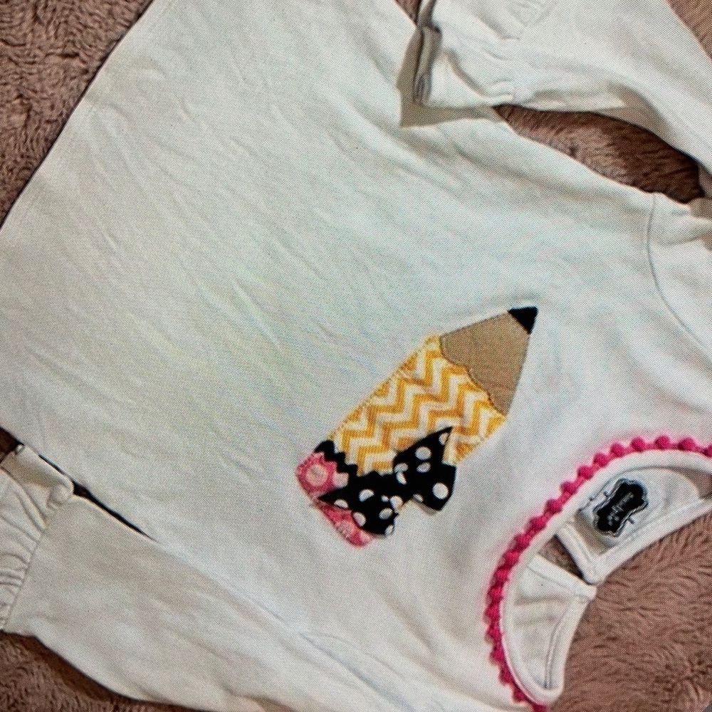 Long sleeve features delightful design kid’s shirt